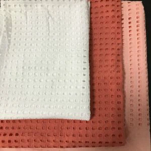 Tömör fűzőlyukú hímzőszövet